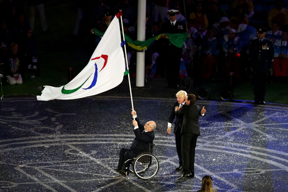 From left: Sir Philip Craven, president of the International Paralympic Committee; Boris Johnson, mayor of London; and Eduardo Paes, mayor of Rio de Janeiro,  perform the Paralympic flag handover ceremony.