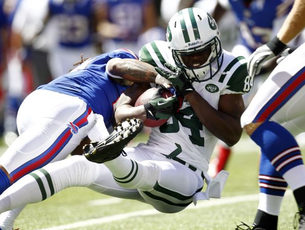 No. 27 Stephon Gilmore of the Buffalo Bills tackles No. 84 Stephen Hill of the New York Jets on Sunday.