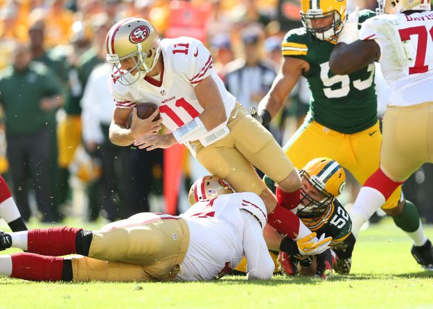 No. 11 Alex Smith of the 49ers is sacked by No. 52 Clay Matthews of the Packers on Sunday.