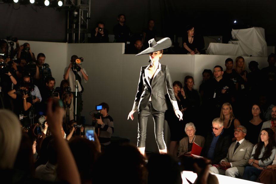 A model at the Norisol Ferrari show. Ferrari is known to favor menswear-inspired silhouettes and classic styles.