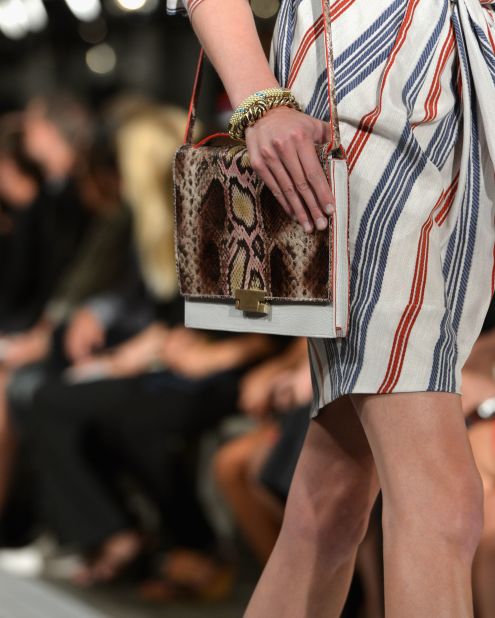 Iconic American designer Tommy Hilfiger's line showcases nautical themes with snakeskin accessories.