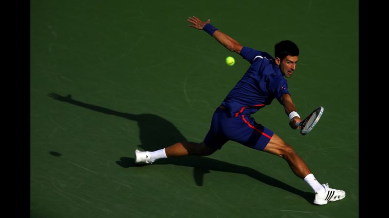 Novak Djokovic of Serbia returns a shot on Monday.