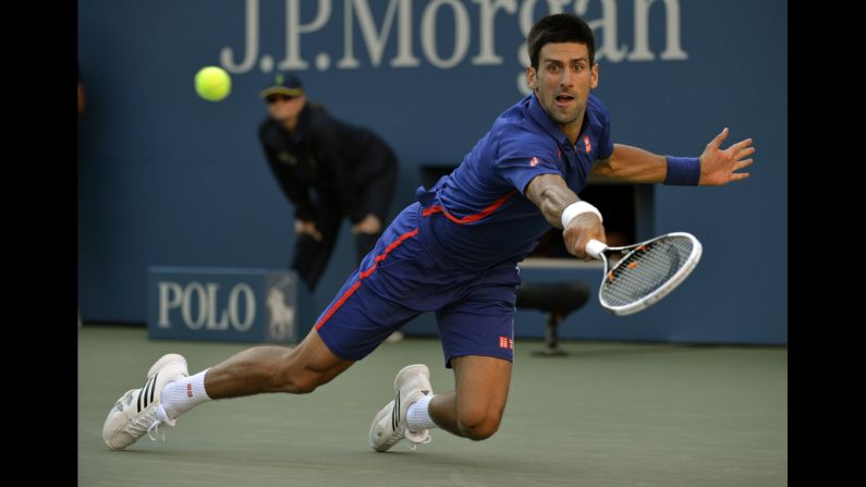Novak Djokovic returns a shot against Andy Murray on Monday.