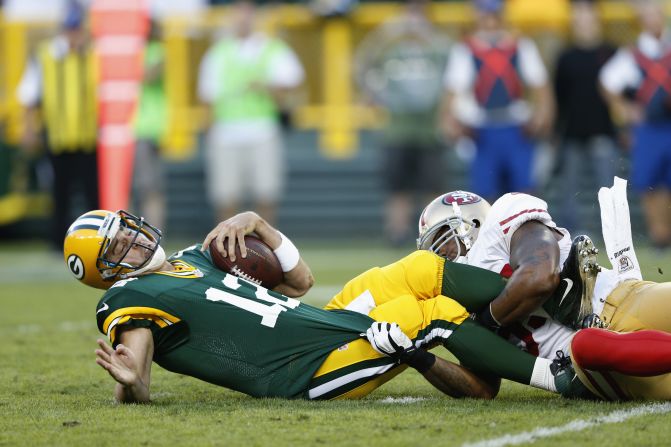 No. 55 Ahmad Brooks of the 49ers sacks No.12 Aaron Rodgers of the Packers on Sunday, September 9, in Wisconsin. 