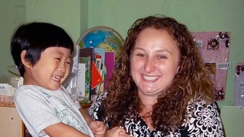 Kari Bowerman shares a laugh with one of her students in Seoul, South Korea. 