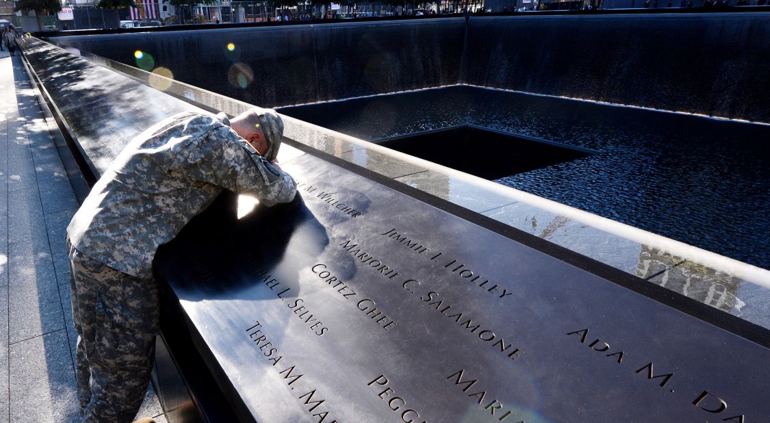 Scott Willens, who joined the U.S. Army three days after the terrorist attacks of 9/11, pauses at the South Pool of the 9/11 Memorial on Tuesday.