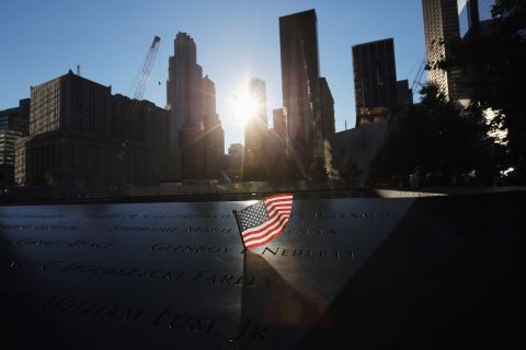 A flag sits in a name on the 9/11 Memorial on Monday.