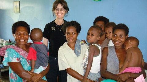Dr. Deborah Mills works abroad in a vaccination clinic. 