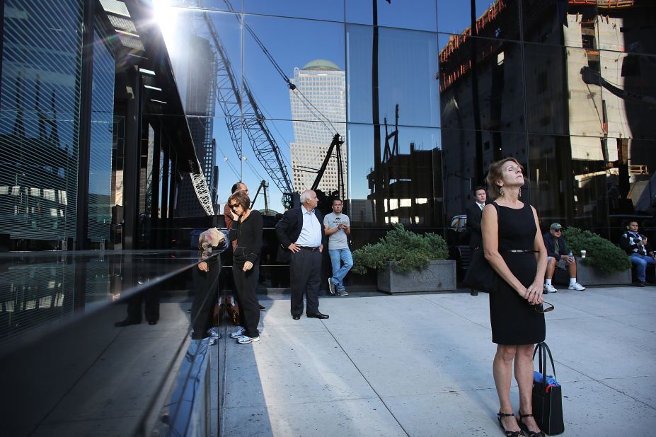  New Yorkers pause near the World Trade Center site on Tuesday.