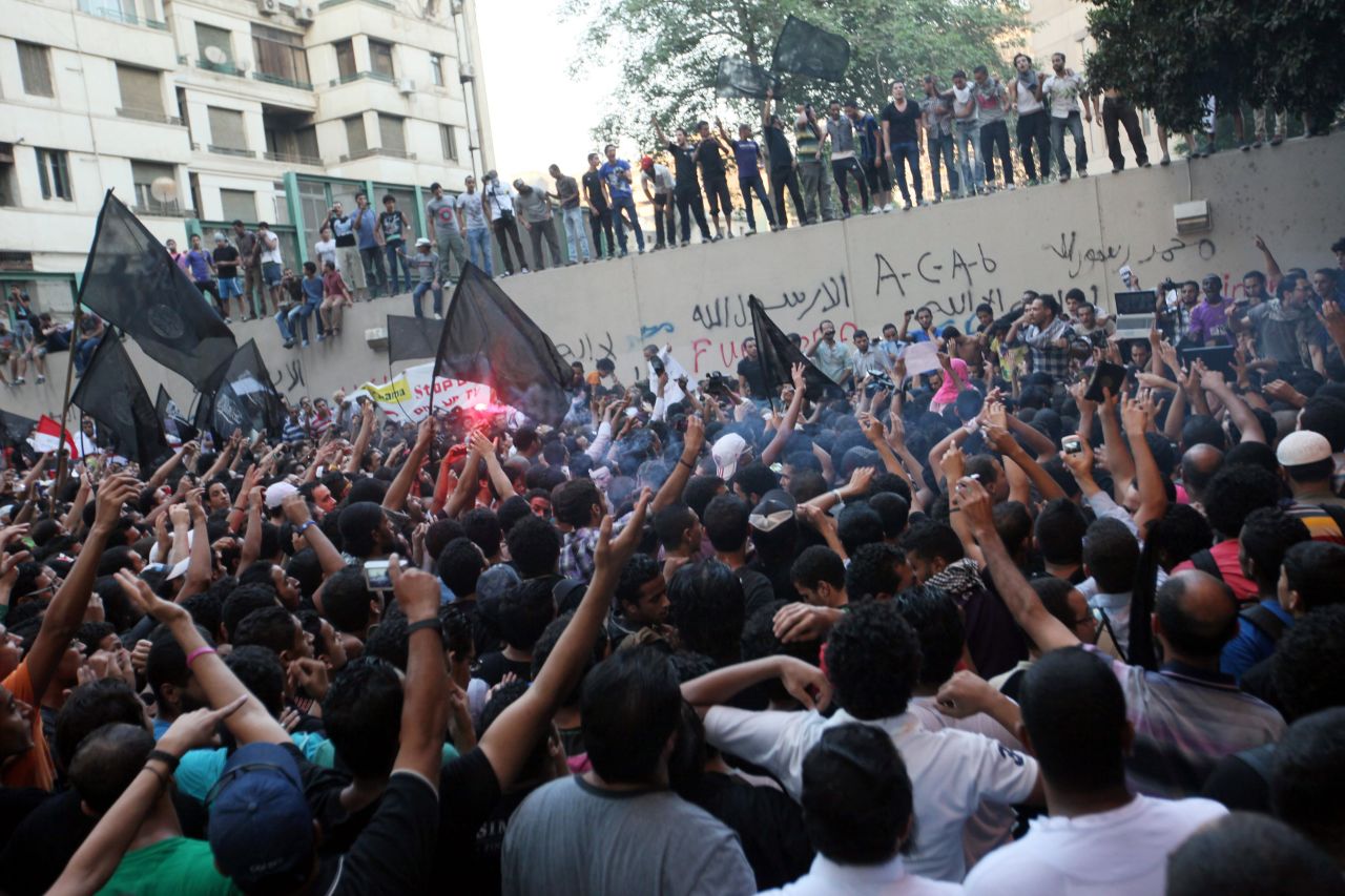 Protesters gather along the U.S. Embassy wall. <a href="http://www.cnn.com/2012/09/12/africa/gallery/libya-us-consulate-attack/index.html">Photos: Attack on the U.S. Consulate in Libya kills four</a> or <a href="http://www.cnn.com/SPECIALS/world/photography/index.html">see more of CNN's best photography</a>.