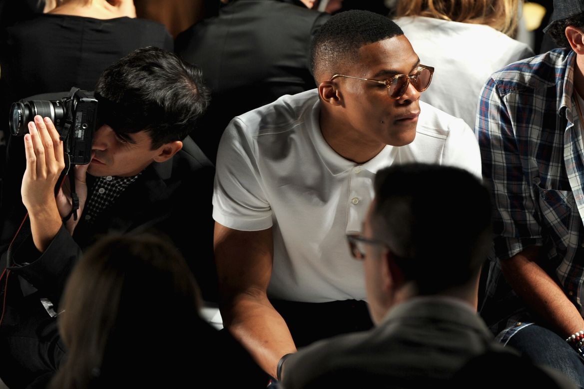 Basketball gold-medalist Russell Westbrook scores a prime seat at the Lacoste spring 2013 show.