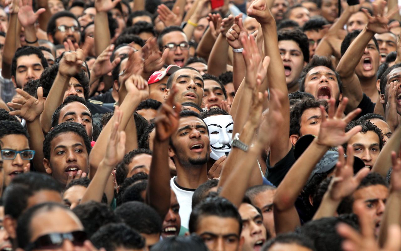 Demonstrators yell outside the U.S. Embassy.