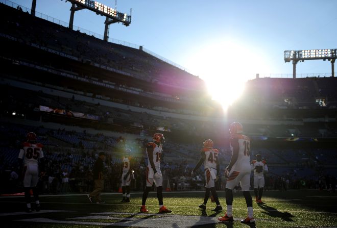 Cincinnati Bengals players warm up on the field before taking on the Baltimore Ravens at M&T Bank Stadium on Monday in Baltimore, Maryland.