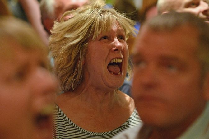 A fan of tennis player Andy Murray reacts as she watches his U.S. Open men's singles final match against Novak Djokovic in the bar of The Dunblane Hotel on Monday in Murray's hometown of Dunblane, Scotland.