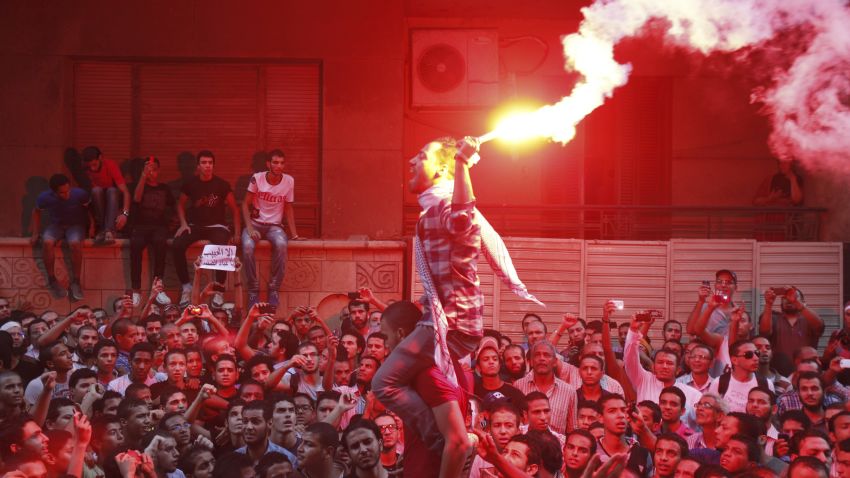 People shout slogans and light flares in front of the U.S. embassy during a protest against what they said was a film being produced in the United States that was insulting to the Prophet Mohammad, in Cairo September 11, 2012. Egyptian protesters scaled the walls of the U.S. embassy in Cairo on Tuesday and some pulled down the American flag during the protest, witnesses said. REUTERS/Amr Abdallah Dalsh ( EGYPT - Tags: POLITICS CIVIL UNREST RELIGION ENTERTAINMENT) REUTERS /AMR ABDALLAH DALSH /LANDOV