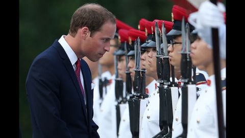 William stops to speak to an honor guard on arrival at the Istana, home of Singapore's president and working office of the prime minister, during the Diamond Jubilee tour on Tuesday.
