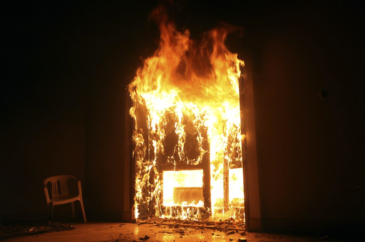The U.S. Consulate in Benghazi is set on fire during a protest. Armed gunmen attacked the compound on Tuesday evening, clashing with Libyan security forces before the latter withdrew as they came under heavy fire.