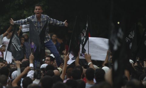 People shout in front of the U.S. Embassy in Cairo.