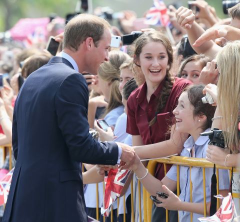 Britain's Prince William, Duke of Cambridge, meets children at Gardens by the Bay Wednesday in Singapore.