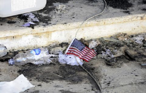 A small American flag is seen in the rubble on September 12.