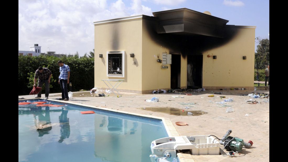 People inspect the damage at the U.S. Consulate in Benghazi, Libya, on Wednesday, the day after four people were killed.
