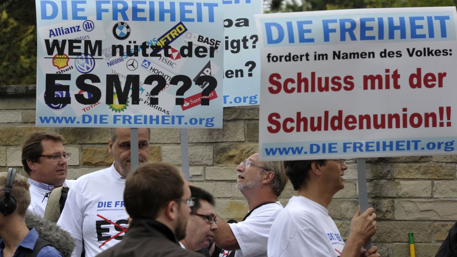 Protesters call for the end of the European Stability Mechanism in front of the Constitutional Court in Karlsruhe, Germany