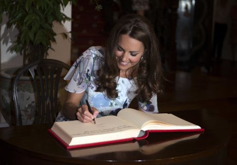 Catherine signs the visitors' book at Eden Hall on Wednesday. 