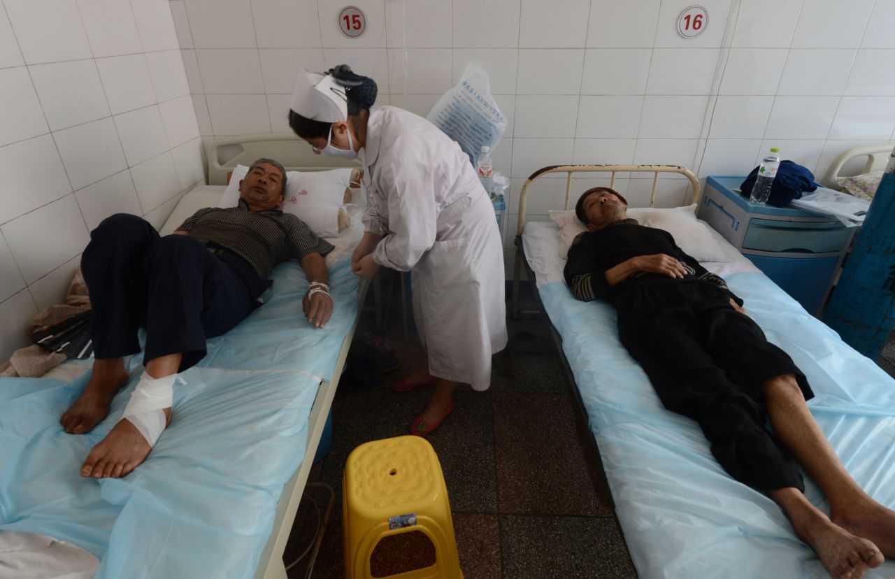 Injured villagers at the Yiliang People's Hospital lie on beds on Monday, September 10, receiving care for injuries after a series of earthquakes hit Yiliang County, Yunnan Province, on Friday. 