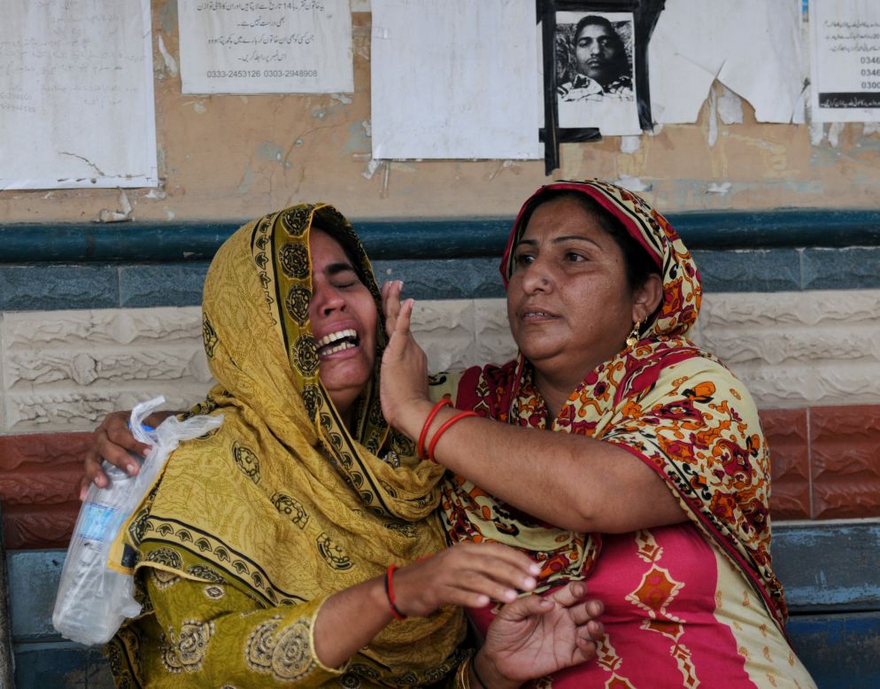 More than 280 Pakistanis perished in horrific fires that destroyed two factories in Karachi, Pakistan on Tuesday, September 12, 2012. The  unprecedented industrial tragedy prompted calls Wednesday for an overhaul of poor safety standards.  Pakistani women grieve as they wait at the morgue to identify their relatives who died in one of the fires.