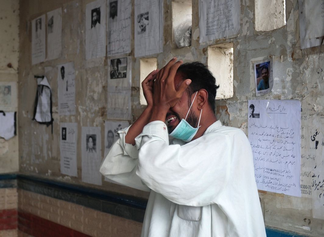 A Pakistani man weeps for his relative who was killed in the garment factory fire.
