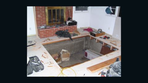 The point of no return: Once there's a huge hole in your living room, might as well drop a hot tub into it.