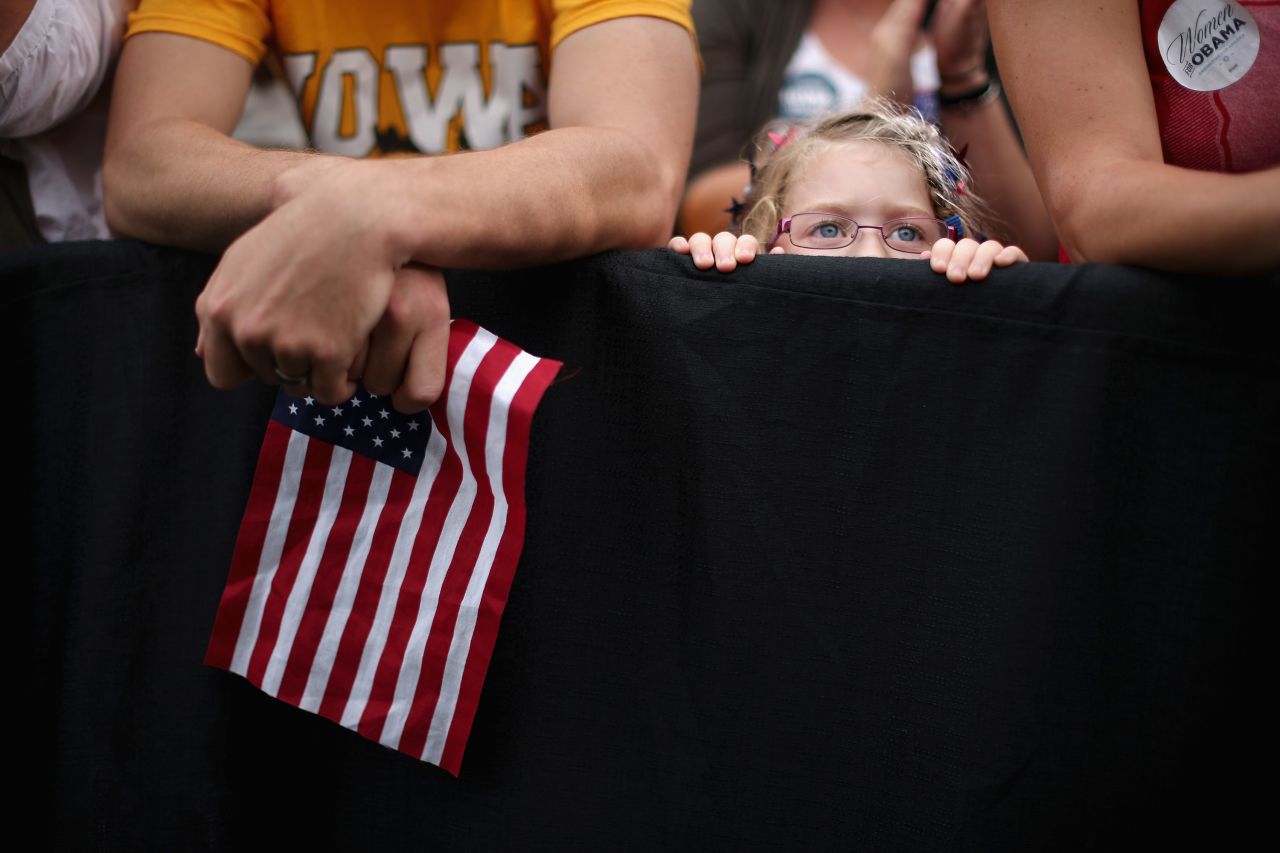 A girl listens to President Obama speak at the University of Iowa on Friday.