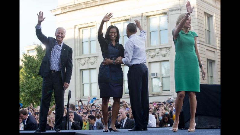 Vice President Joe Biden, first lady Michelle Obama, President Obama and Biden's wife, Jill, wave after Friday's campaign event at the University of Iowa.