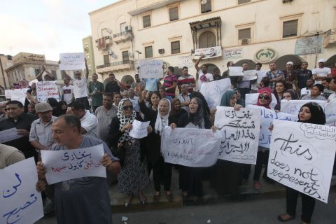 Demonstrators gather in Libya on September 12 to condemn the killers and voice support for the victims.