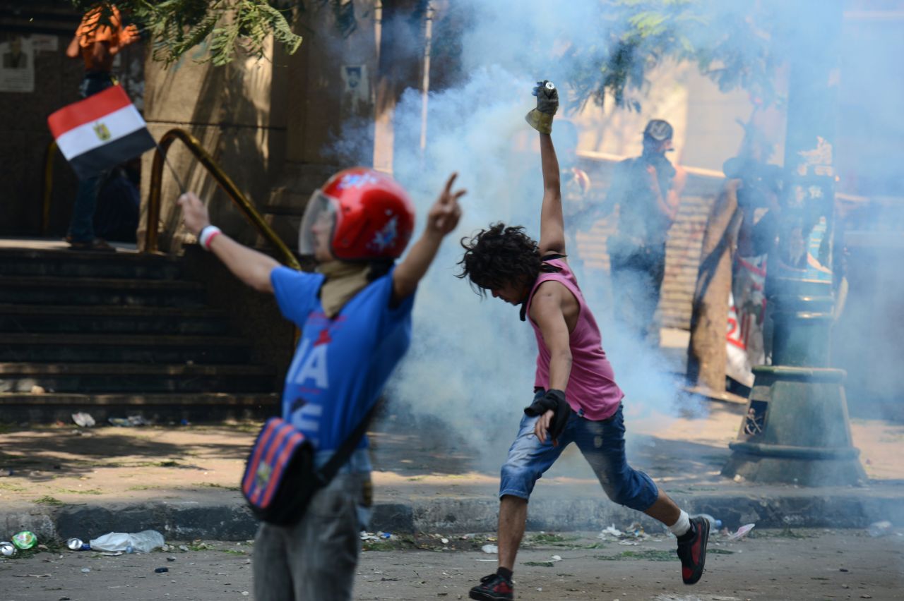 Police use tear gas on crowds protesting Thursday outside the U.S. Embassy in Cairo.
