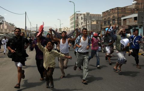 Protesters chant during a march to the U.S. Embassy in Sanaa, Yemen, on Thursday, September 13. One protester was killed in clashes when Yemeni security forces dispersed hundreds of demonstrators who gathered around and inside the U.S. Embassy in Sanaa.