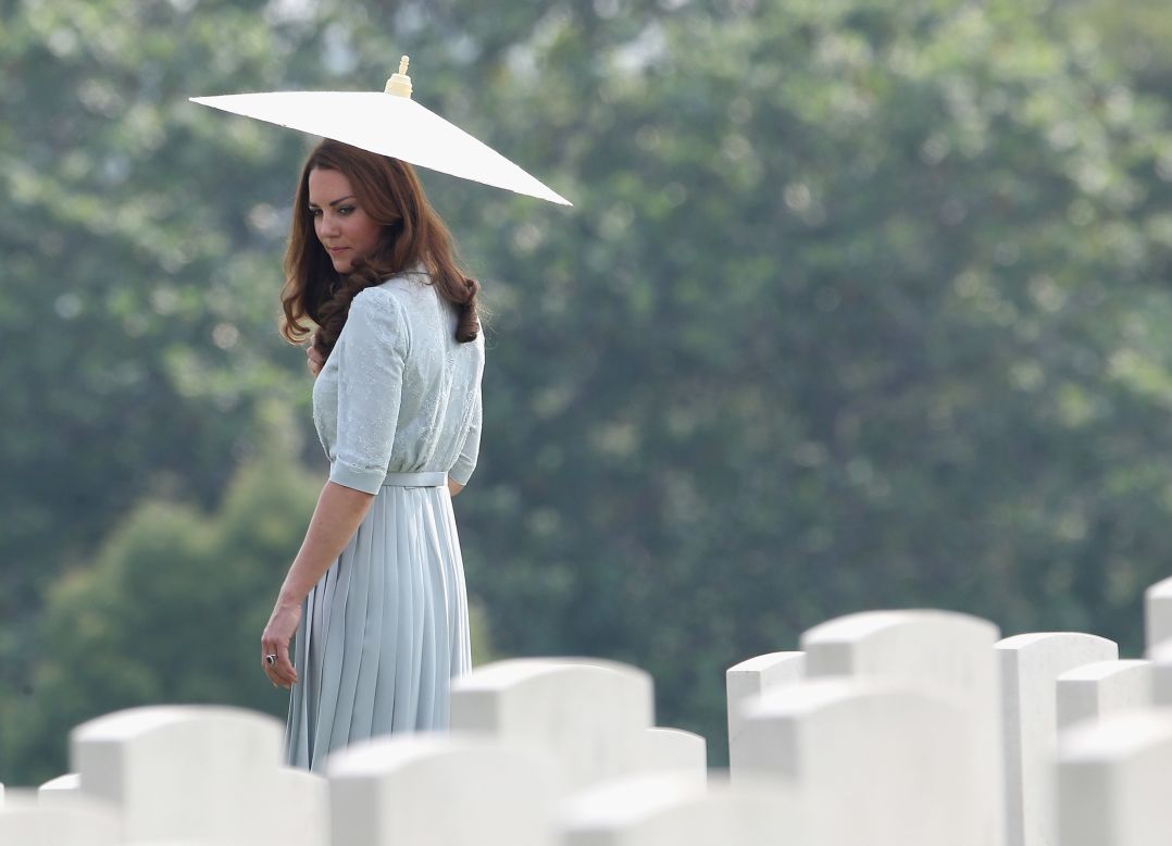 Catherine, Duchess of Cambridge, glances back at war graves as she leaves Kranji Commonwealth War Cemetery on the third day of her Diamond Jubilee Tour of the Far East with husband Prince William on Thursday, September 13 in Singapore.