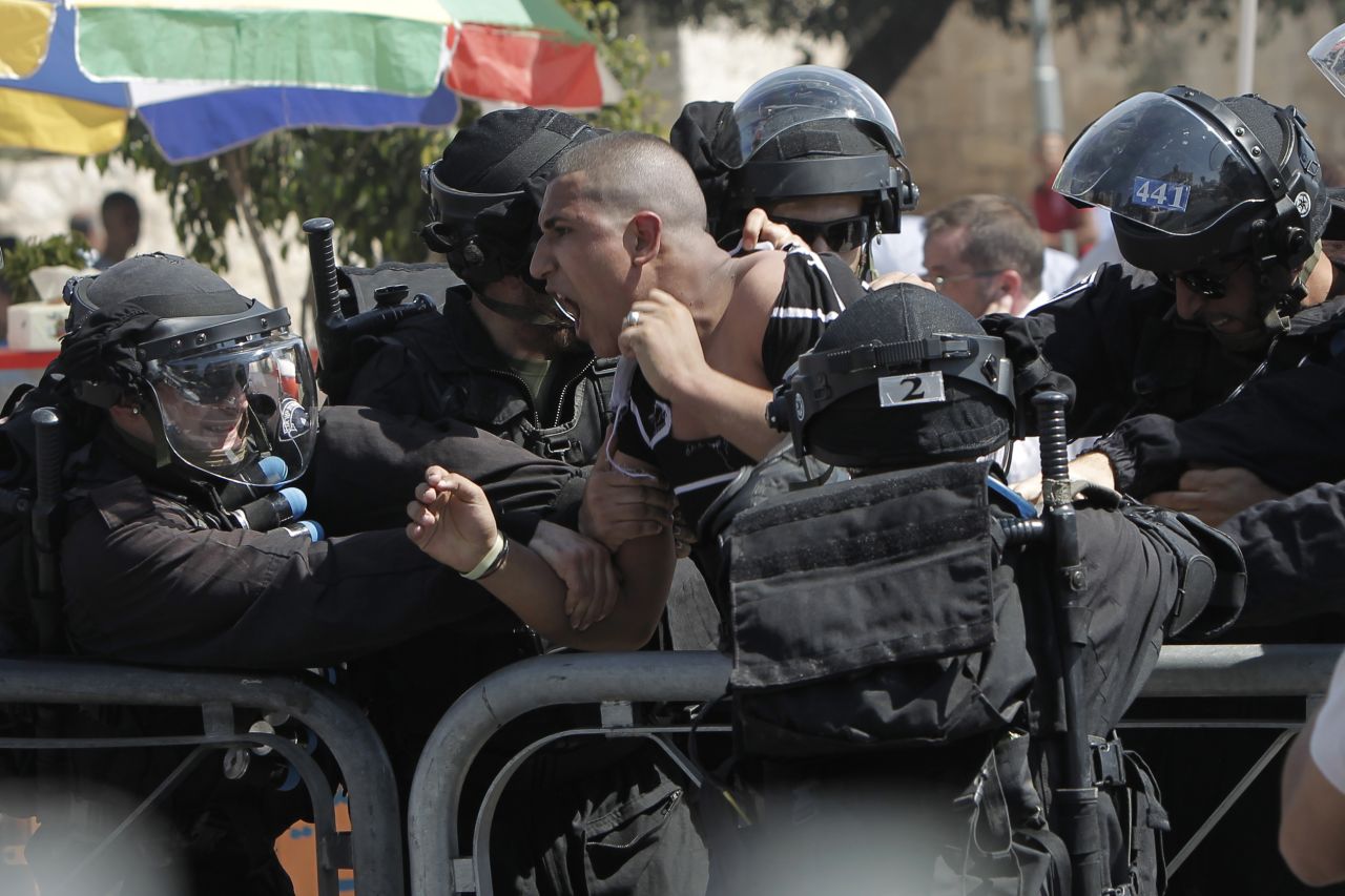 Israeli police arrest a Palestinian protester on Friday.