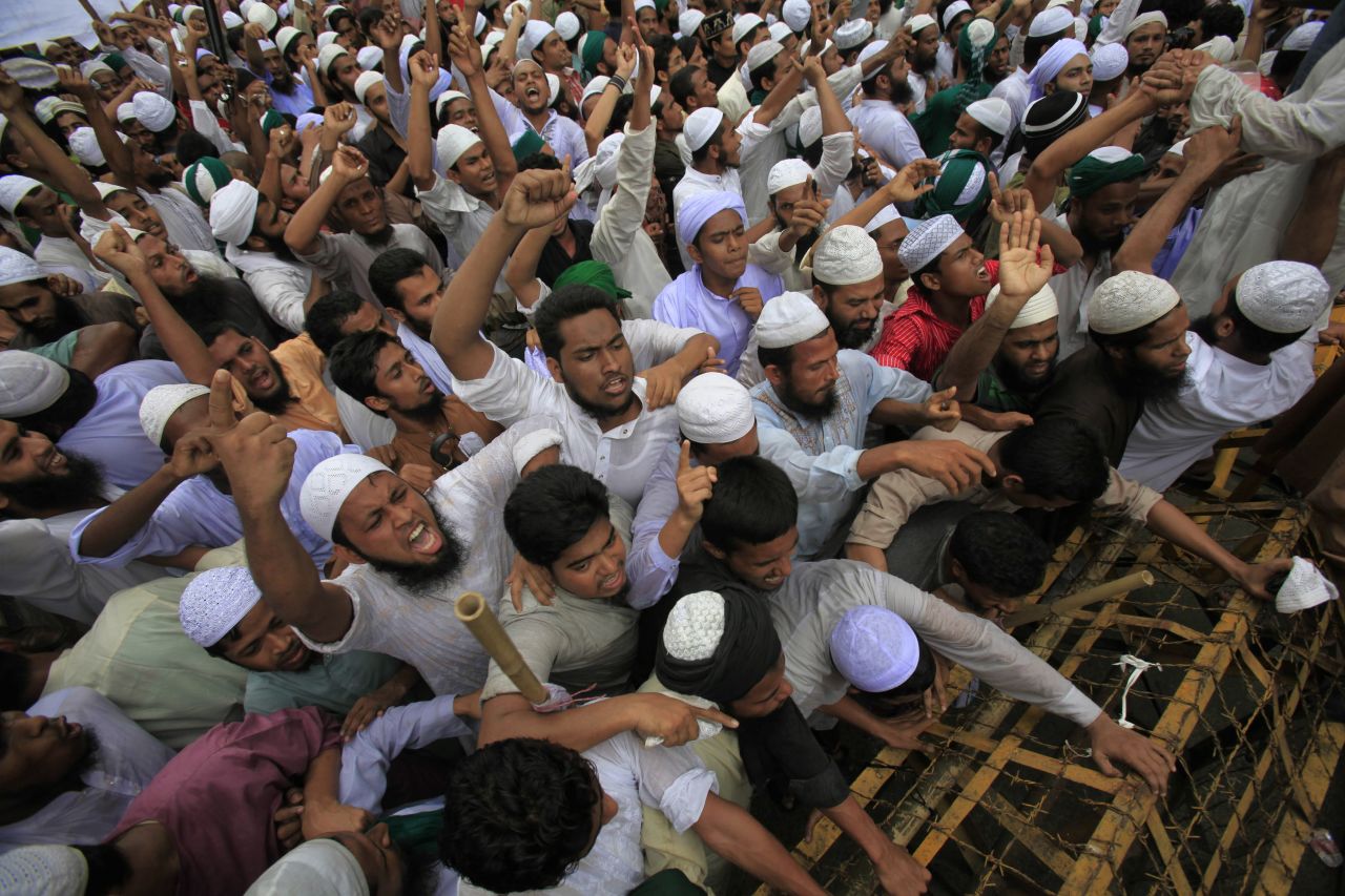 Bangladeshi Muslims attempt to break a police barricade during a protest in Dhaka on Friday.