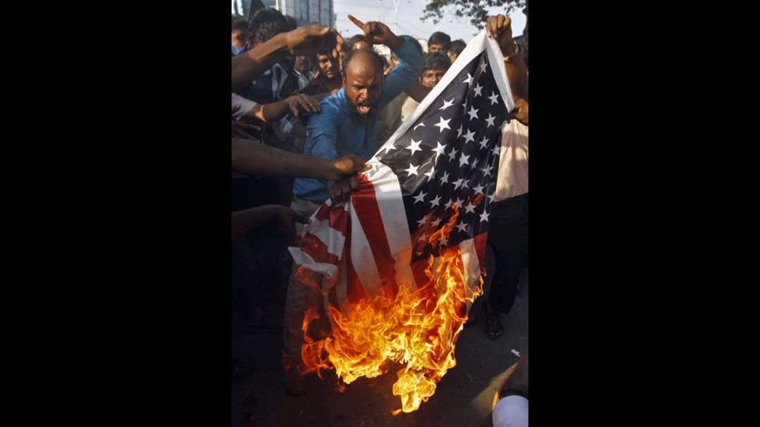 Muslim protesters burn a U.S. flag  outside the U.S. Consulate in the southern Indian city of Chennai on Friday.