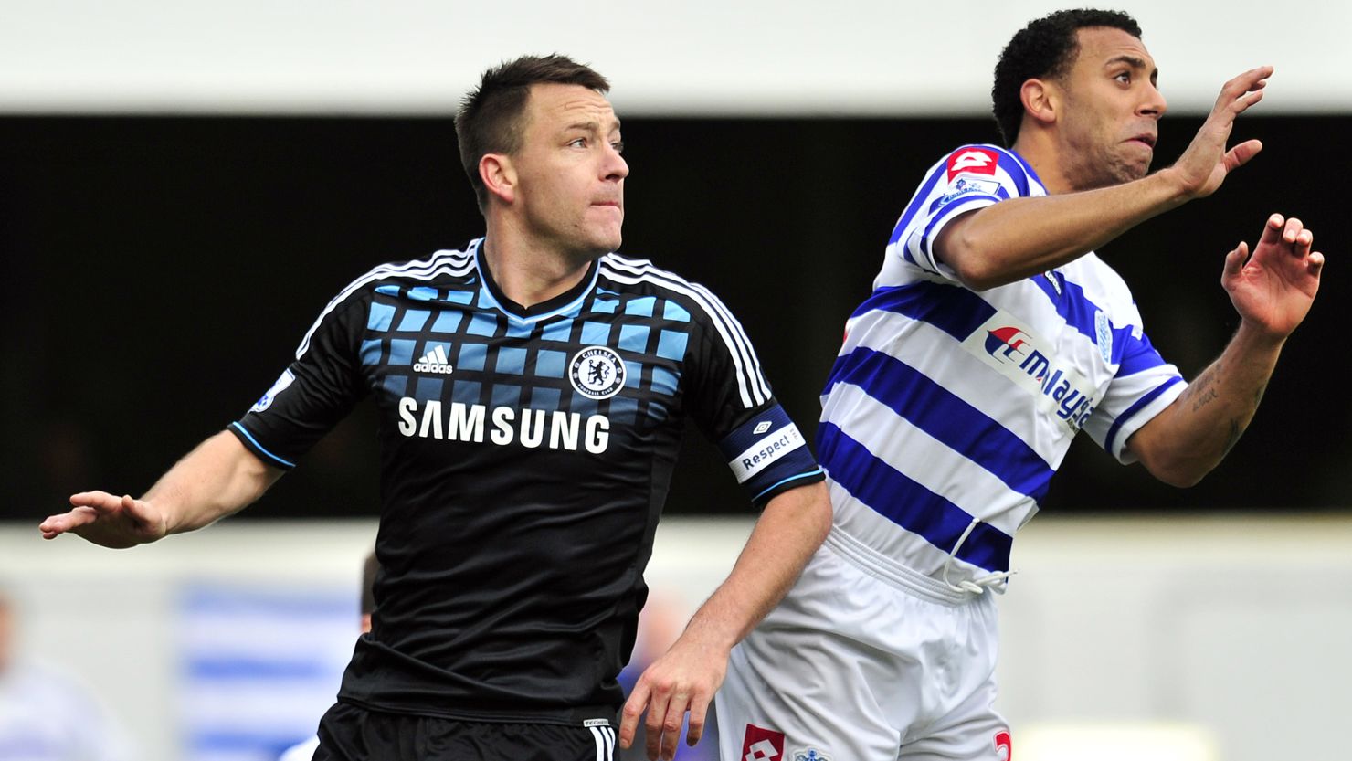 Chelsea's John Terry (left) and Anton Ferdinand of Queens Park Rangers compete during an FA Cup tie in January 2012 
