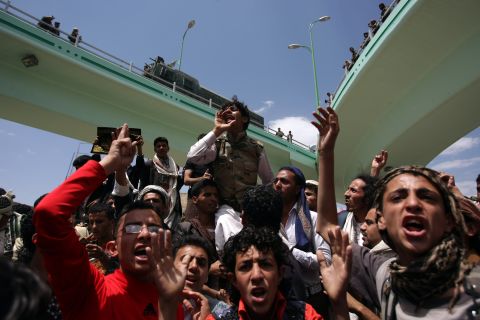 Yemeni protesters shout during a demonstration near the U.S. Embassy in Sanaa on Friday.