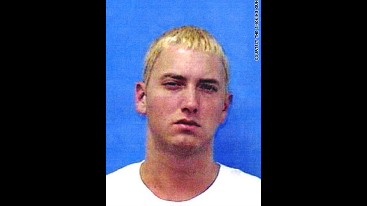 Marshall Mathers, aka Eminem, was booked on gun charges twice in June 2000. Police said both arrests stemmed from fights -- the first over his estranged wife, Kim, and the second against rival rap group Insane Clown Posse.  