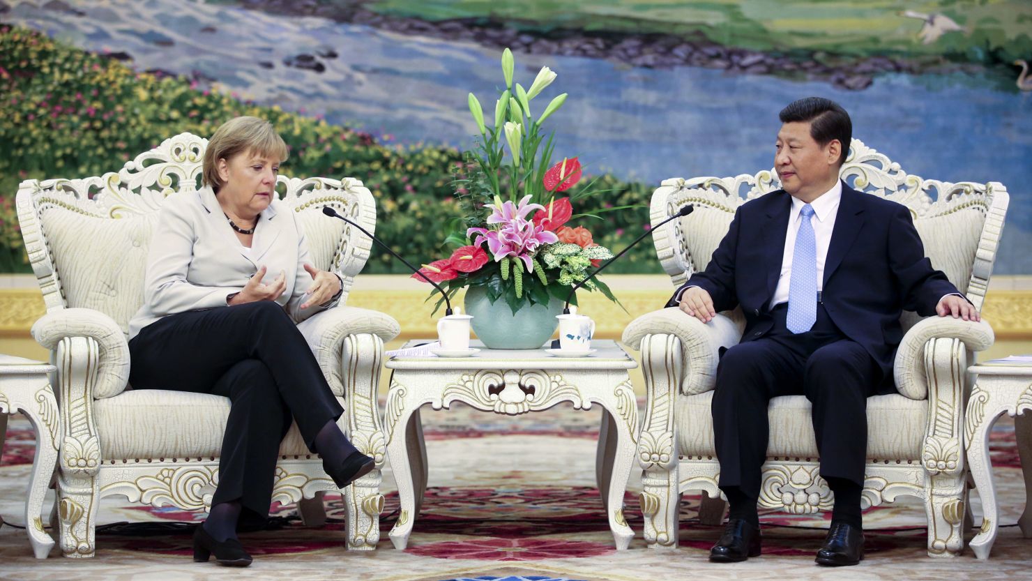 German Chancellor Angela Merkel and Chinese Vice President Xi Jinping talk during their meeting in Beijing on August 30, 2012. 