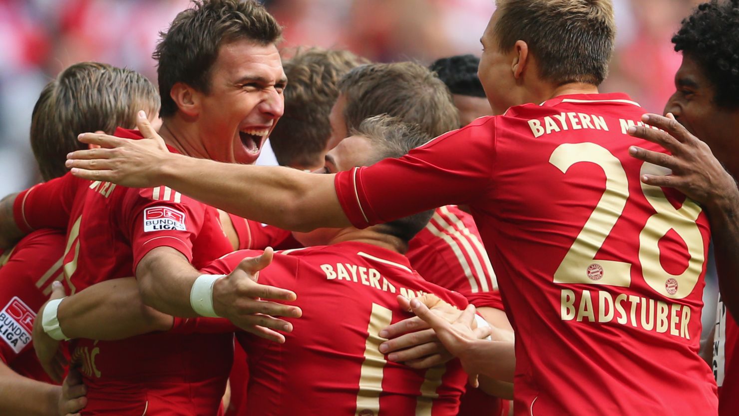 Mario Mandzukic (left) celebrates with his teammates after putting Bayern ahead in the second minute against Mainz 