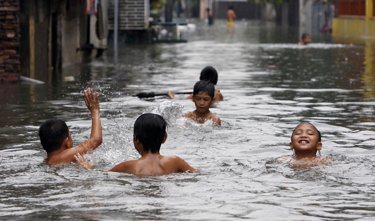 Children swim in water on a flooded street in San Juan, metro Manila on Saturday. <a href="http://www.cnn.com/2012/08/07/world/gallery/philippines-flooding/index.html">See photos of last month's  flooding in Manila from monsoon rains.</a>