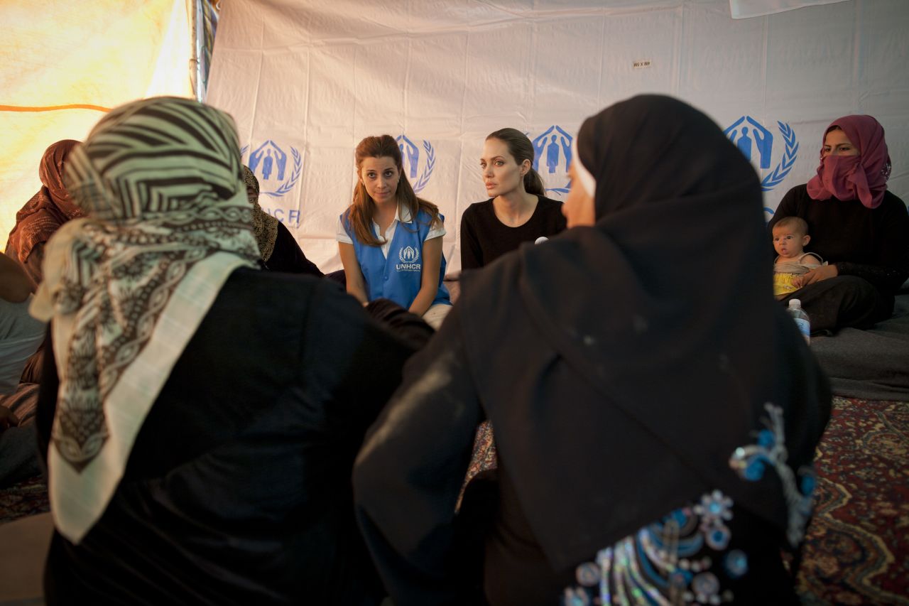 Jolie meets with refugees at the Za'atri refugee camp in Jordan to demonstrate solidarity with Syrian refugees and pay tribute to the Jordanian government for their refugee protection.