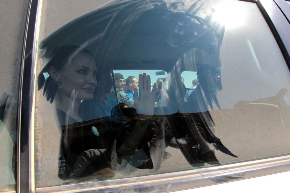 Jolie waves to the crowd as she arrived at Al Za'atri refugee camp on Wednesday.