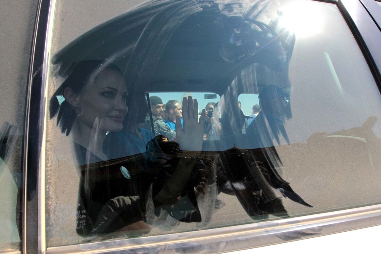 Jolie waves to the crowd as she arrived at Al Za'atri refugee camp on Wednesday.