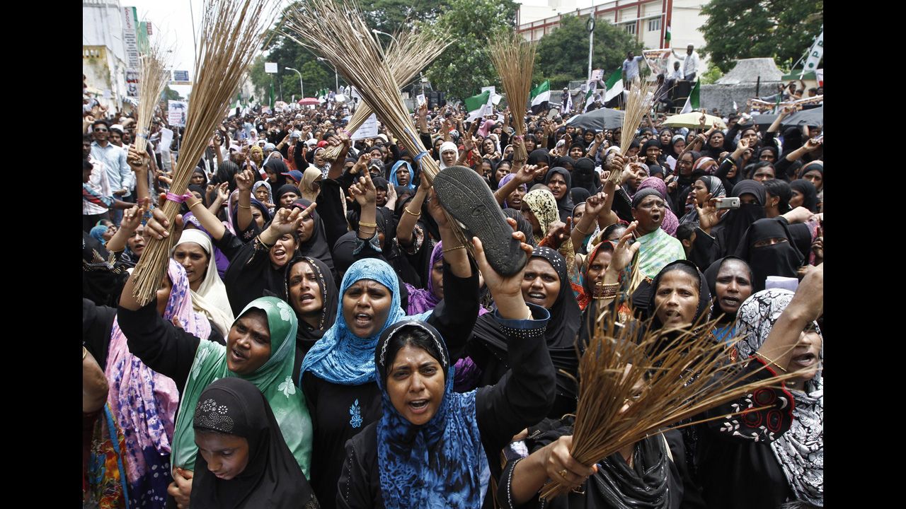 Muslim protesters holding shoes and brooms shout anti-U.S. slogans on Saturday during a protest against the film they consider blasphemous to Islam near the U.S. Consulate-General in Chennai, India.